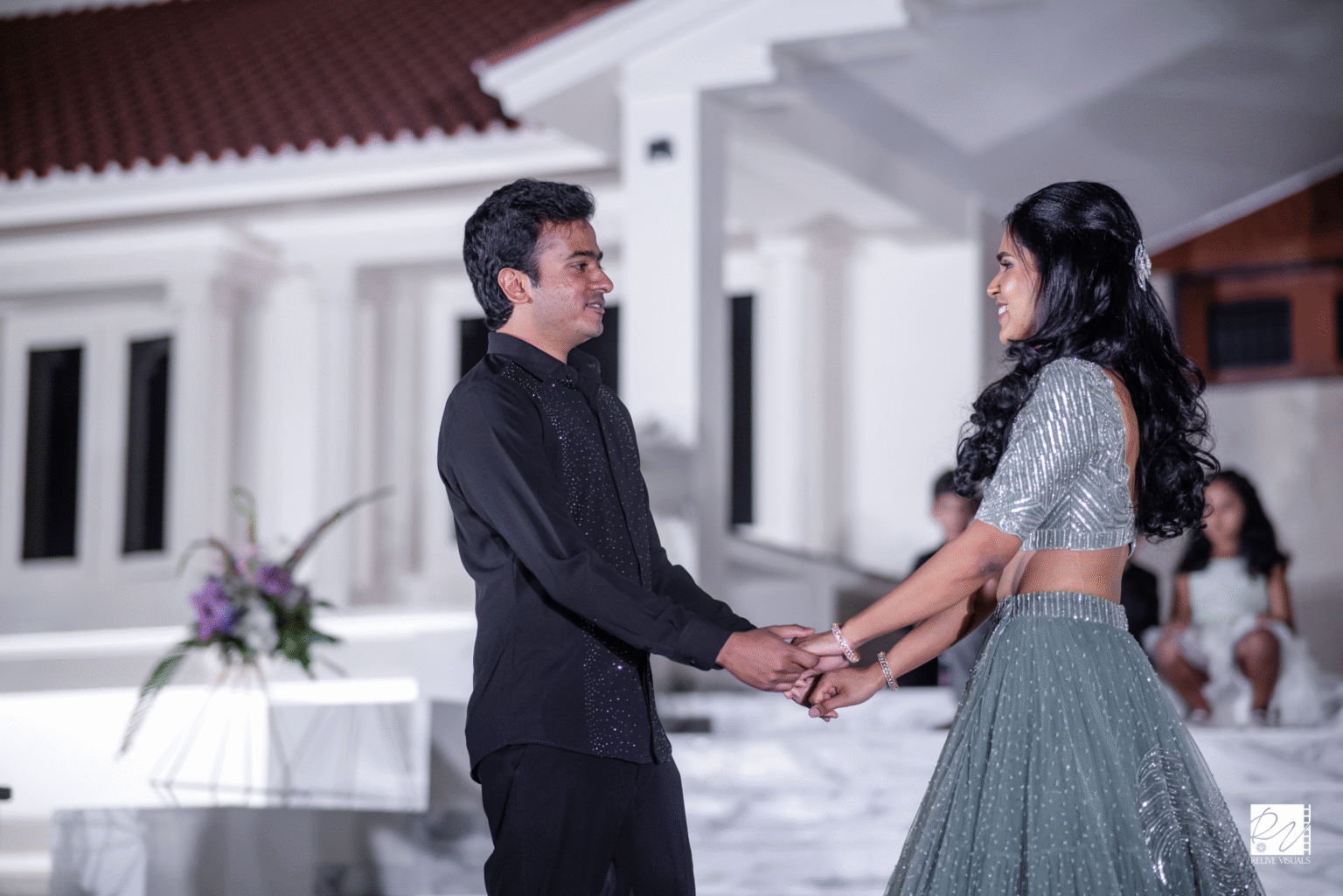 Couple holding each other on the dance floor, preparing to begin their dance