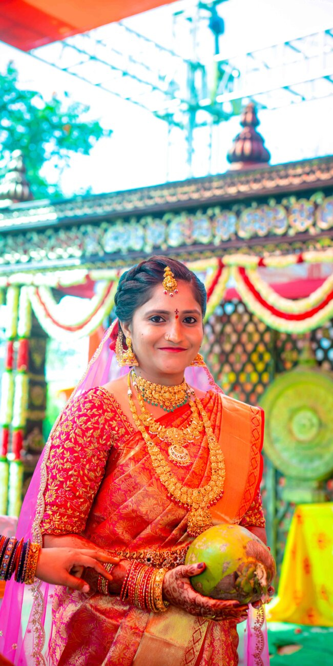 "Telugu bride in traditional silk saree with temple jewelry, smiling gracefully during her wedding ceremony"
